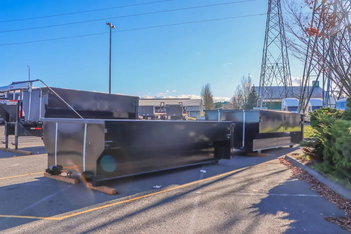 Roll-off dumpster ready for waste disposal at job site for Demolition Dumpster Rental in Brewton